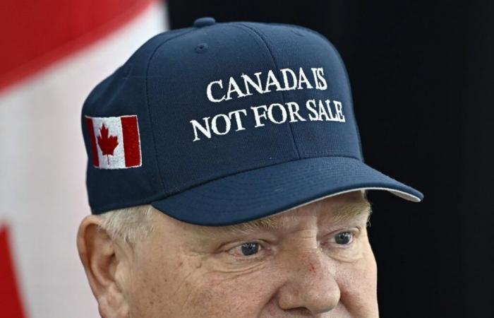 Ford wears a cap that says “Canada is not for sale”