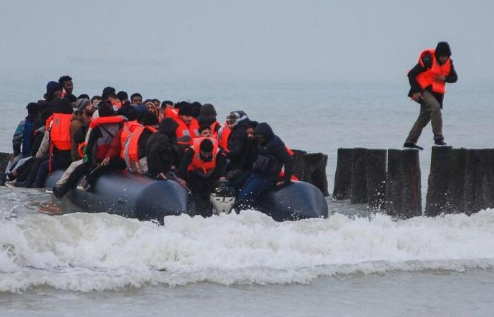 Rescuers save 68 migrants aboard a boat at sea off Calais