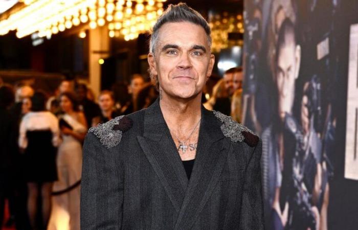 Robbie Williams at the cinema as a monkey