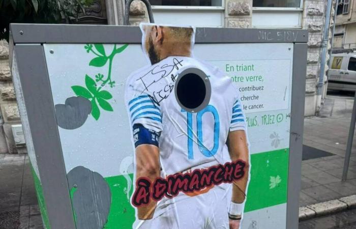 Why do giant stickers bearing the image of Dimitri Payet adorn trash cans in Nice?