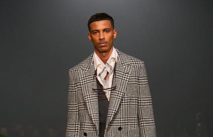 At the Zegna fashion show, actor John Turturro causes a sensation