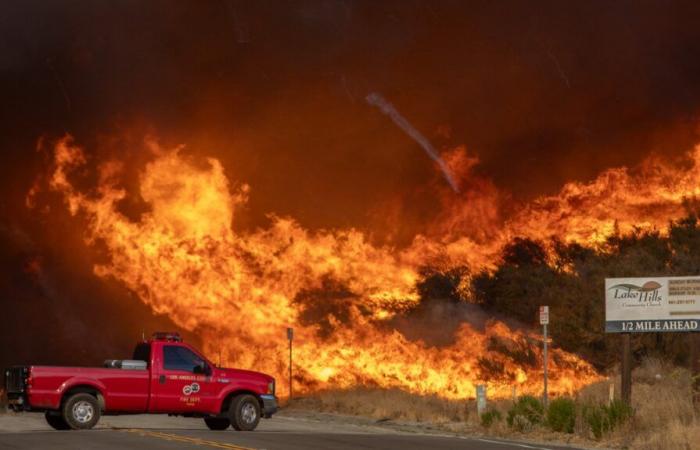 a new fire rages north of Los Angeles, evacuation orders issued for 20,000 residents