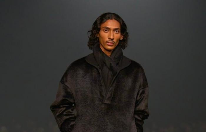 At the Zegna fashion show, actor John Turturro causes a sensation