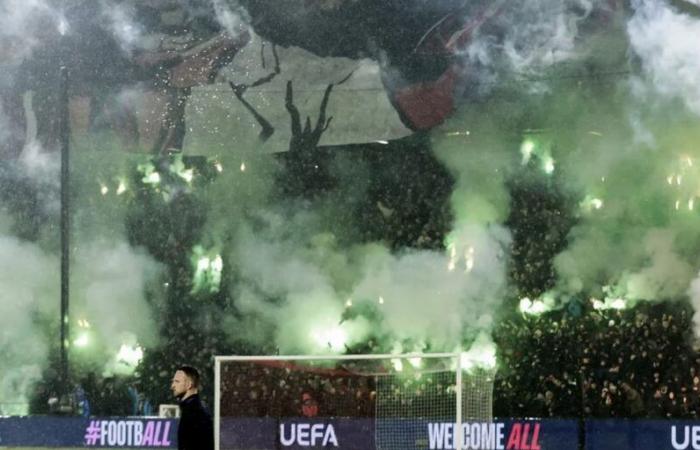 Champions League match suspended after fan trouble in the crowd forces players off pitch