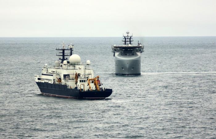 The Royal Navy marks the Yantar as it sails up the Channel