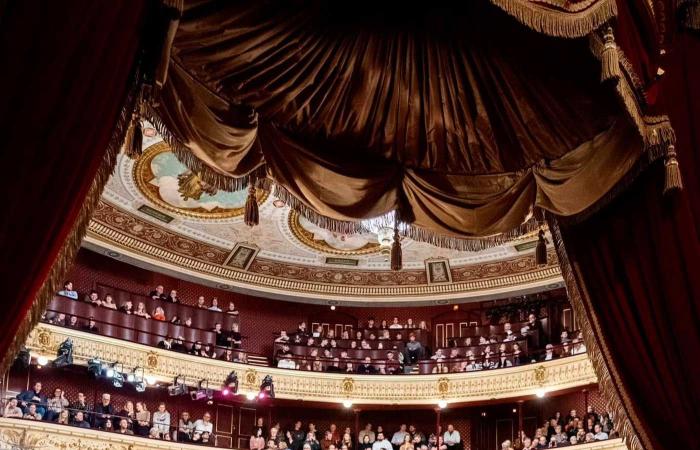 King Frederik and Queen Mary occupy the royal box for their first performance at the Royal Danish Theater