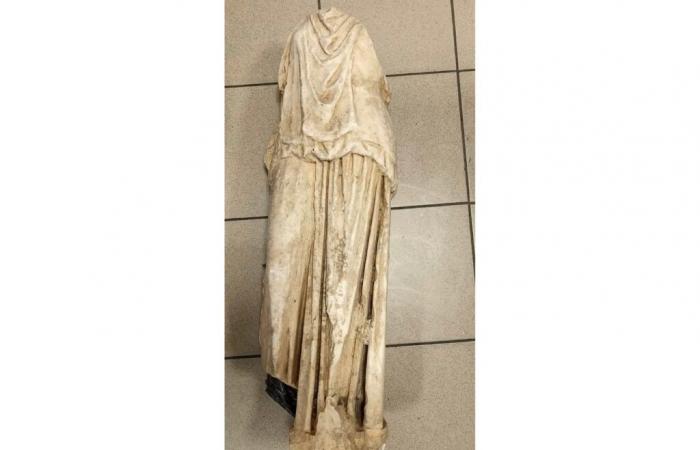 an ancient marble statue found “near the trash cans” in Greece