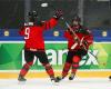 Canada thumps Swiss to top Group B