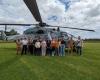 Villeneuve-sur-Lot. An army helicopter meets college students