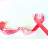 why does a pink ribbon symbolize the fight against breast cancer?