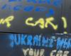 mysterious pro-Ukrainian tags painted on 45 parked vehicles