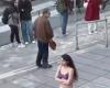 a student undresses in front of her university to protest against the moral police, before being arrested