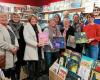 Green Santa Claus from Secours populaire prepares his bag of books, in Ploemeur