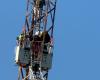 hung from a pylon to protest against his social situation