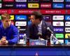 Demidov looks fearful in front of his coach at press conference