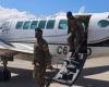 an airliner bound for Port-au-Prince hit by gunfire