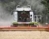 A combine harvester hits a town hall building