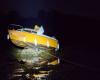 A beached boat and a woman stranded by the tide in the Gulf of Morbihan