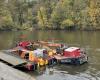 Why is a boat transporting pieces of tree to Mayenne?