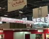 Why will the price of books fall in Switzerland after the sanction against Gallimard?