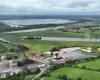 How is EDF committed to preserving the Baupte peat bog in the Cotentin Marshes Park?