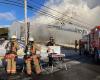 A commercial building ravaged by flames in Lac-Saint-Charles