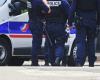 in Paris, a man brandishes a gun during the demonstration for Palestine