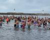 More than 1,000 brave people in the icy water for the “first swim of the year”