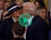 Donald Trump tries to kiss Melania Trump but the First Lady's hat decides otherwise